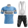 The 1983 Bianchi Retro Short Sleeve Cycling Set embodies the spirit of 1983 Bianchi with its light blue and white jersey featuring Bianchi Piaggio branding, paired with black bib shorts, matching logos, a zipper, and white suspenders—ideal for cycling enthusiasts.