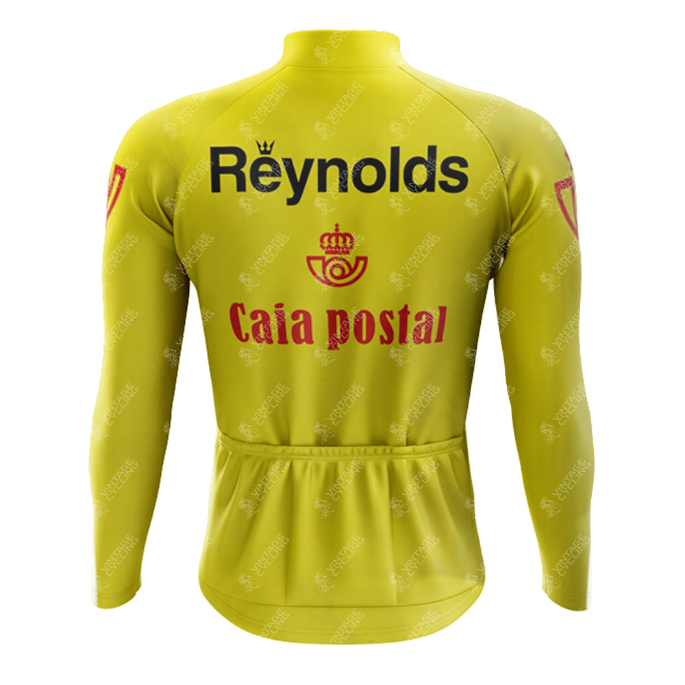 The 1983s yellow Reynolds Retro Long Sleeve Cycling Set features a long-sleeve jersey with Reynolds and Caja Postal logos on the back, placed above Caja Postal, and includes a fleece-lined option with convenient lower back pockets for cool-weather rides.