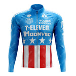 The 1990s 7-ELEVEN Retro Long Sleeve Cycling Set, crafted from lightweight blue polyester, imitates the American flag with white stars on the chest and red stripes below. Iconic 7-Eleven logos evoke nostalgia, and it features a full front zipper. Available with a fleece option.
