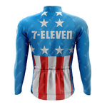 The 1990s 7-ELEVEN Retro Long Sleeve Cycling Set features a back view of its cycling jersey, displaying an American flag design. Made from lightweight polyester, it has a blue top with white stars and red and white stripes, with the 7-ELEVEN logo prominently on the upper back.