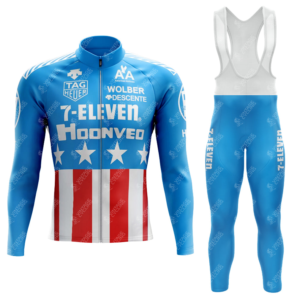 Introducing the 1990s 7-ELEVEN Retro Long Sleeve Cycling Set, a lightweight polyester outfit in red, white, and blue with stars and stripes. The jacket showcases iconic 7-Eleven and Tag Heuer branding, paired with blue bib tights featuring classic 7-Eleven text on the leg.