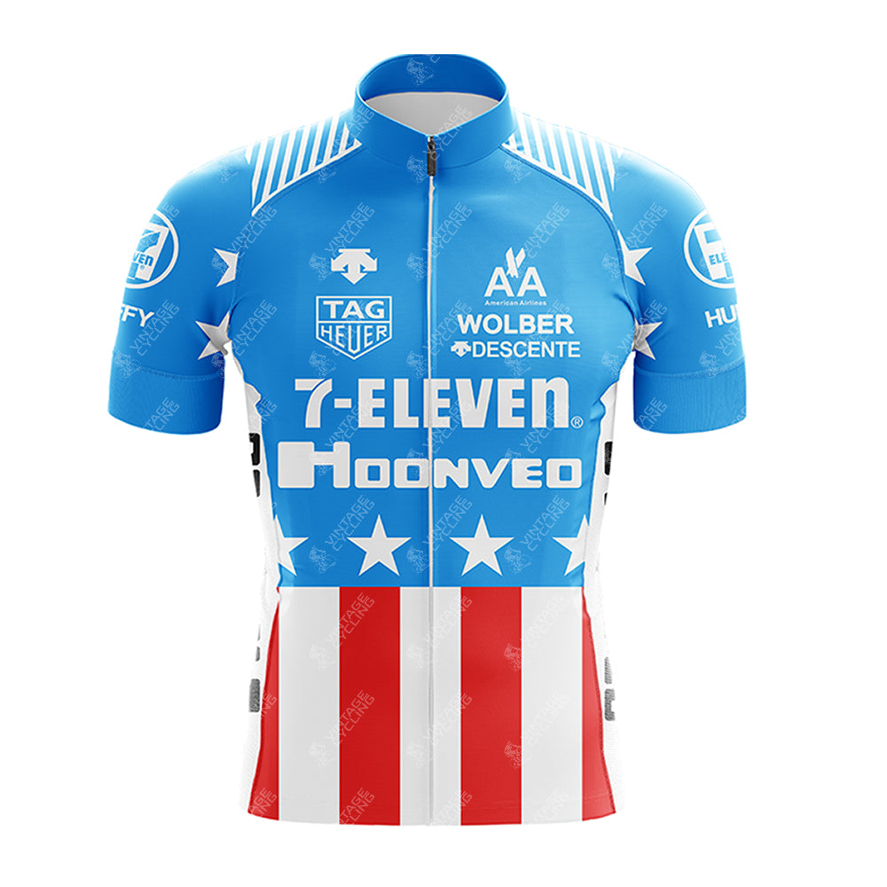 Short sleeve cycling jersey in blue, red, and white stars and stripes design with sponsor logos like 7-ELEVEN Retro, Tag Heuer, and Huffy.