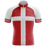 The Believe Men Short Sleeve Cycling Set features a red jersey with a white cross inspired by the Danish flag and "DENMARK" printed on the sleeves—ideal for any performance cyclist.