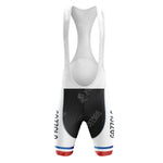 Back view of LA REDOUTE Retro Short Sleeve Cycling Set with a white top and black shorts featuring vintage blue and red hem stripes. SYNERGY CYCLES is subtly visible on the fabric.