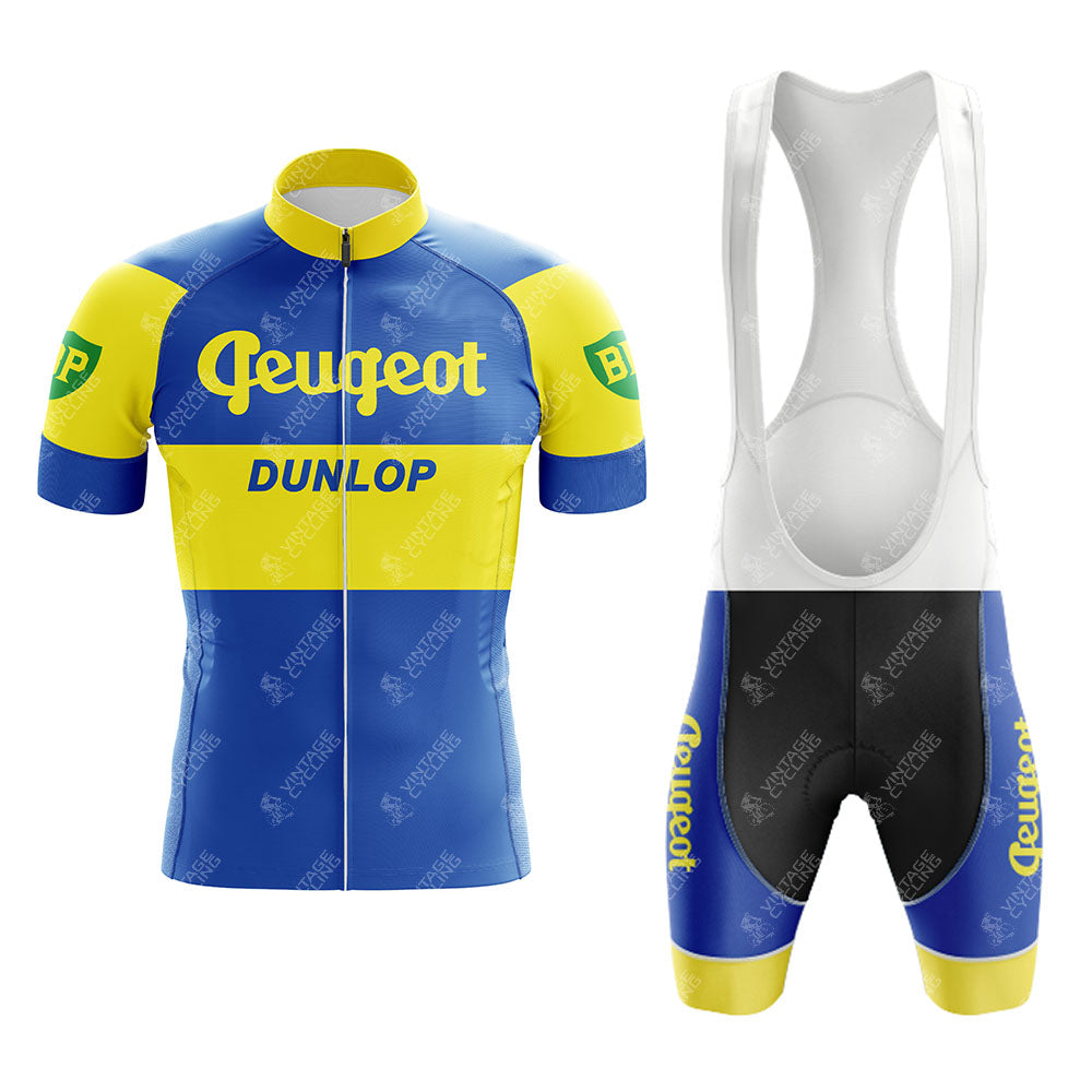 Reynolds Aluminio Blue Retro Short Sleeve Cycling Set featuring Peugeot and Dunlop logos; includes a breathable jersey and matching bib shorts. Green BP logos on the sleeves add a classic touch.
