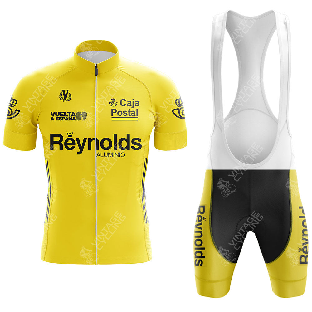 The Del Tongo-MG Maglificio Retro Short Sleeve Cycling Set features a yellow jersey with sponsor logos, black details, and matching bib shorts in black and yellow with white straps, inspired by classic race designs.