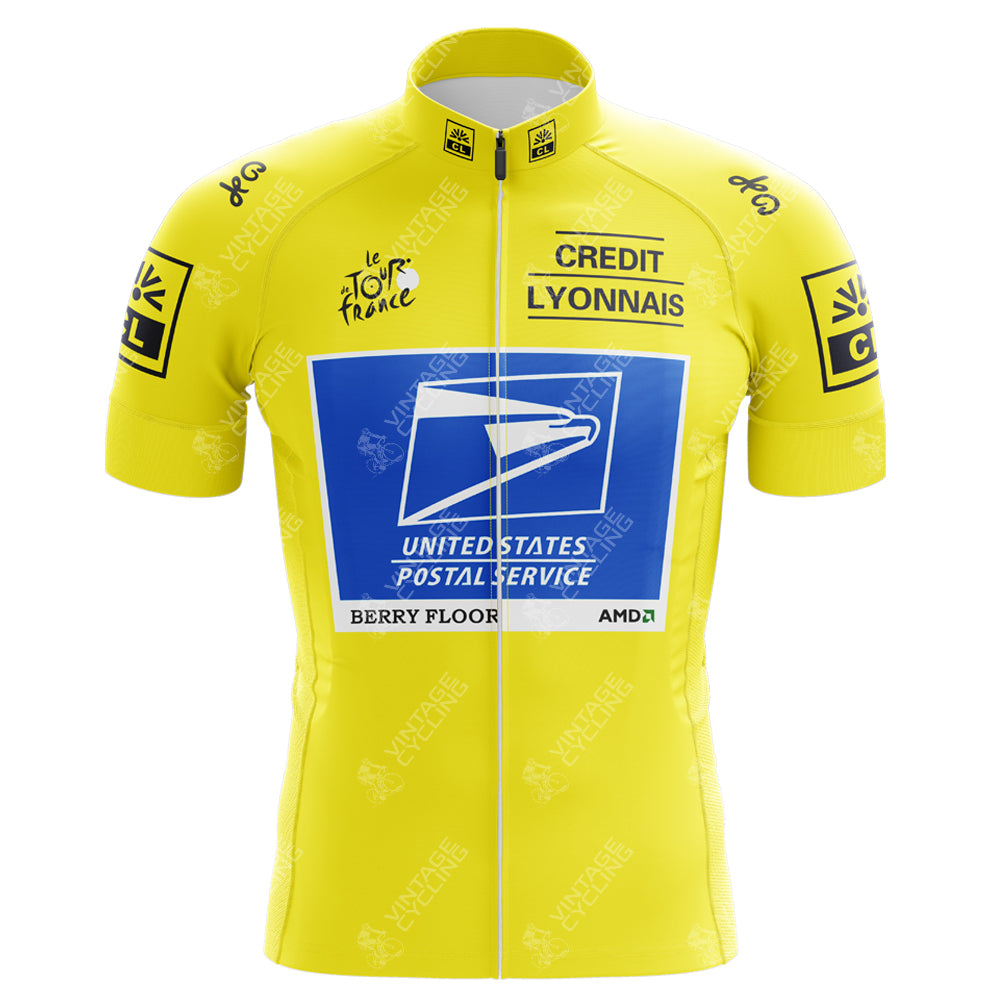 The US Postal Service Yellow Tour de France Retro Cycling Jersey displays a bright yellow design with the Tour de France logo, Credit Lyonnais, and US Postal Service logos. Inspired by Lance Armstrongs iconic era, it includes a prominent front-center blue square for a nostalgic touch.