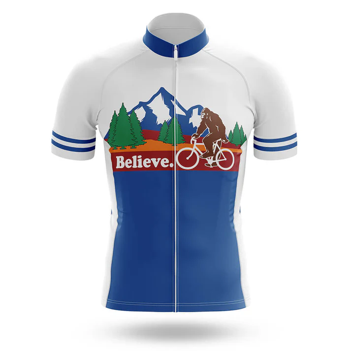 The Italy Men Short Sleeve Cycling Set features blue and white colors, mountain and tree graphics, Bigfoot riding a bike, and "Believe." printed in red on the chest—a standout cycling jersey for adventure enthusiasts.