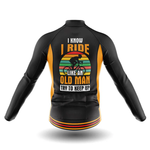 The Dawgs Long Sleeve Cycling Jersey in black and yellow features a graphic cyclist, retro-striped background, and the text: I know I ride like an old man. Try to keep up. Seen from the back for a bold performance look.