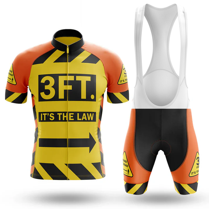 The Éire Men Short Sleeve Cycling Set includes a yellow and orange jersey with "3 FT. ITS THE LAW" in bold and caution stripes, plus black shorts—promoting safe passing distance for cyclists.