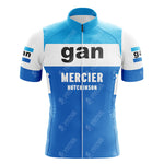The Gllane Retro Short Sleeve Cycling Set features blue and white colors with gan in black on the chest. Below, it reads MERCIER HUTCHINSON in white. The sleeves also have the gan text, all contributing to a vintage cycling vibe with a front zipper design.