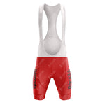 Front view of a cycling bib set from the 1980s red Reynolds Retro Short Sleeve Cycling Set, featuring a white top and vintage red shorts with Reynolds boldly printed. The material looks lightweight, reminiscent of retro cycling attire, designed for comfort.