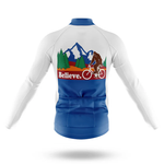 The Scotland Men Long Sleeve Cycling Jersey features blue and white colors, a Sasquatch riding past trees and mountains, with "Believe." in red on the back. This moisture-wicking jersey is ideal for adventure-loving cyclists seeking comfort.