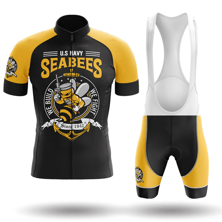 The Specialized V2 Men Short Sleeve Cycling Set features bold black, yellow, and white colors, a cartoon Seabee with tools, U.S. Navy Seabees branding, and the slogan "We Build, We Fight Since 1942" on both the jersey and shorts.