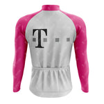The T Retro Long Sleeve Cycling Set features a white body with pink sleeves, a large T on the back, two small gray squares, and sports small logos. Its made from lightweight polyester and offers a fleece option.