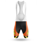 The Éire Men Short Sleeve Cycling Set features cycling bib shorts with a white upper, black center, and bright orange sides. Yellow caution signs and black stripes add standout hazard style—shown on a white background.