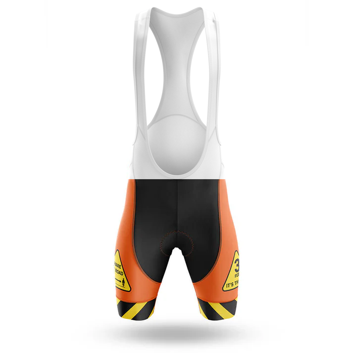 The Éire Men Short Sleeve Cycling Set features cycling bib shorts with a white upper, black center, and bright orange sides. Yellow caution signs and black stripes add standout hazard style—shown on a white background.