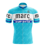 The Marc Superia Blue Retro Short Sleeve Cycling Set features light blue fabric with white and blue stripes, black "marc" text, ZEEP, SAVON, superia in white/black, a front zipper, and a small globe icon.