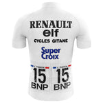 The White Elf Cycling Jersey Tour De France 1983 retro jersey showcases Renault, elf, Cycles Gitane, Super Croix, and BNP logos. It features racing numbers 15, the name L. Fignon above a French flag detail, reminiscent of a classic Tour de France style.