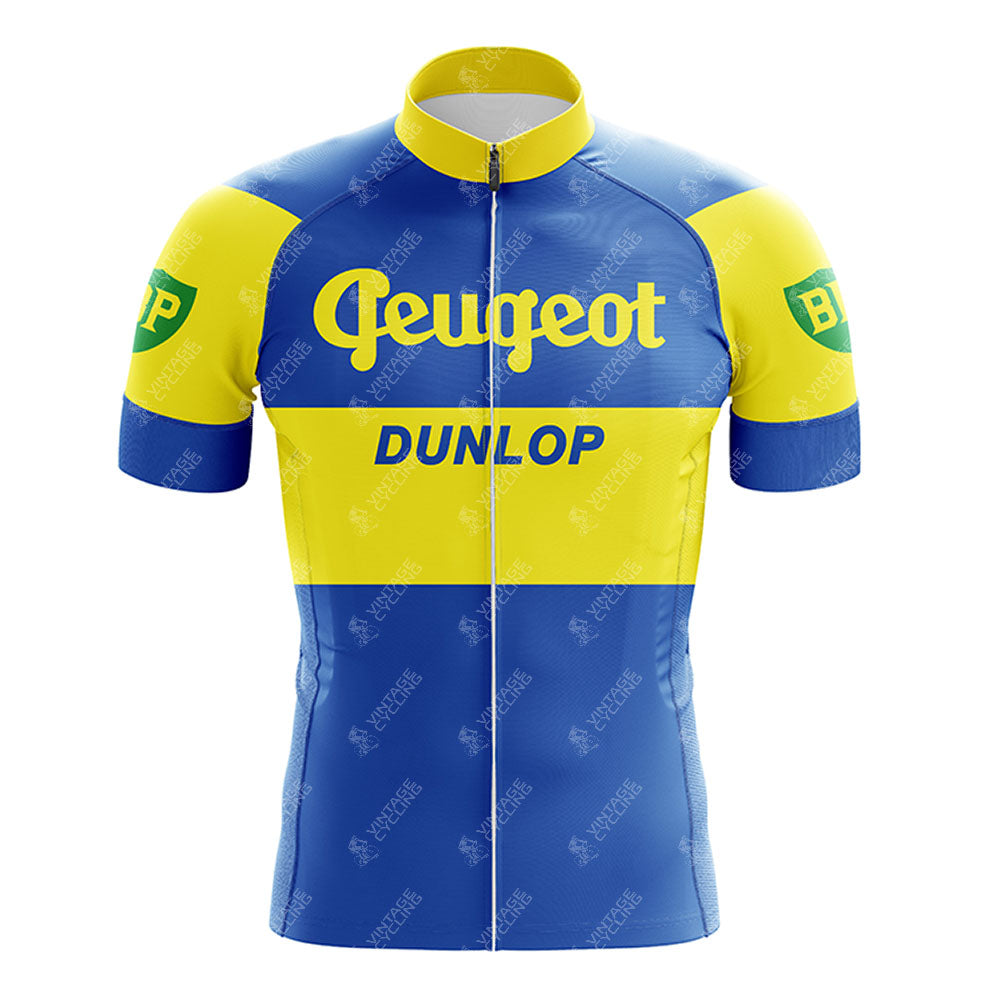 The Reynolds Aluminio Blue Retro Short Sleeve Cycling Set features blue and yellow stripes, Peugeot across the chest, DUNLOP below it, green BP logos on the sleeves, and a full front zipper for easy wear.