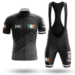 The Snail Cycling Team Men Short Sleeve Cycling Set features a black jersey with ÉIRE and Irish flags, three gray chevrons, Chicago flag details, a full front zip, plus matching shorts with white ÉIRE on one leg.