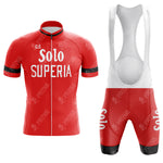 Experience the charm of a retro look with our Legnano Retro Short Sleeve Cycling Set. This red set features a front zipper, black collar, and Solo Superia text. The bib shorts have white straps and black cuffs adorned with Solo on the thighs.