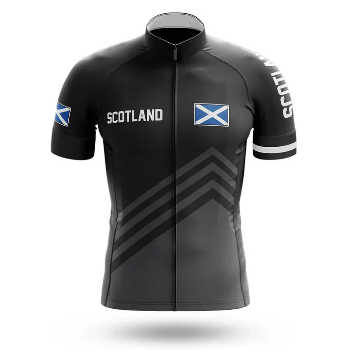 The Drinking Men Short Sleeve Cycling Set includes a black jersey with SCOTLAND and Scottish flags on the chest and sleeves, subtle diagonal stripes, a full zipper, and matching men's bib shorts for a complete cycling look.