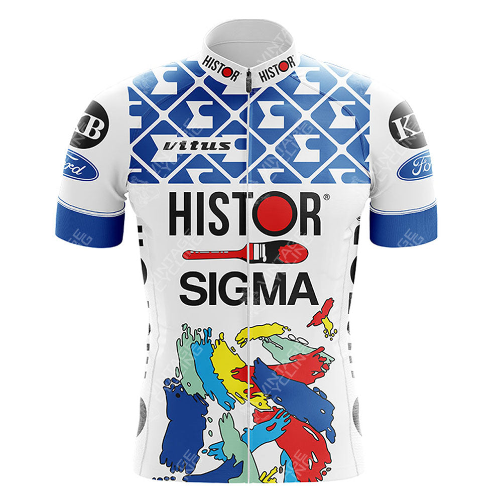The GS Ignis Retro Short Sleeve Cycling Set features blue geometric patterns and multicolored handprints, evoking a retro vibe. Logos include HISTOR SIGMA and Vitus, with vintage KOB and Ford patches on the sleeves.