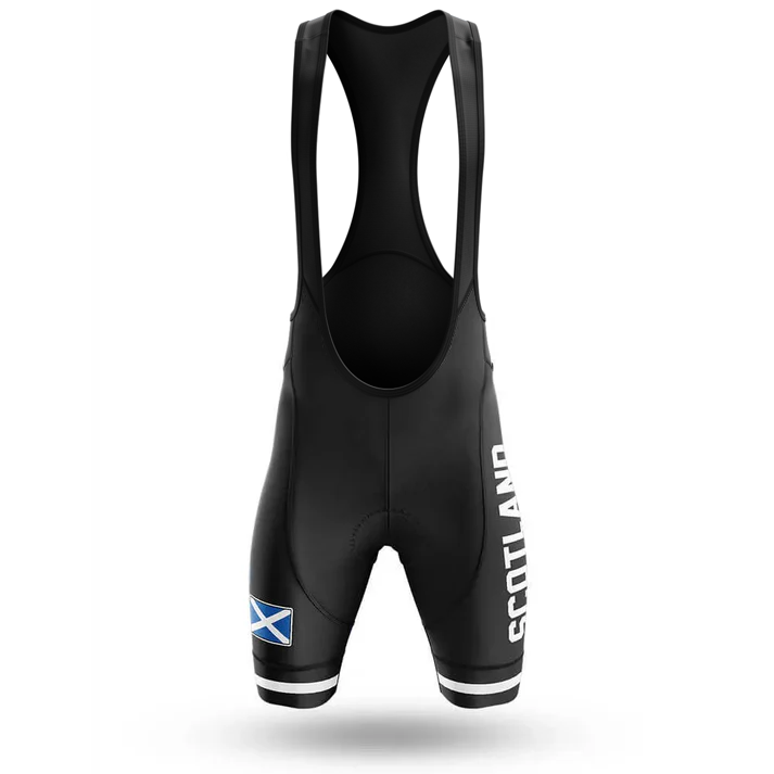 The Drinking Men Short Sleeve Cycling Set includes black men's bib shorts with SCOTLAND printed vertically on one leg, a Scottish flag on the opposite thigh, black suspenders, white leg trim, and matches any cycling kit.