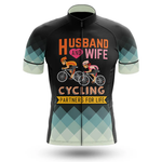 The Marines USMC Men Short Sleeve Cycling Set features a cycling jersey with cartoon illustrations of a man and woman riding bikes, text saying "Husband and Wife Cycling Partners for Life," and Chicago flag-inspired blue and white sleeves.