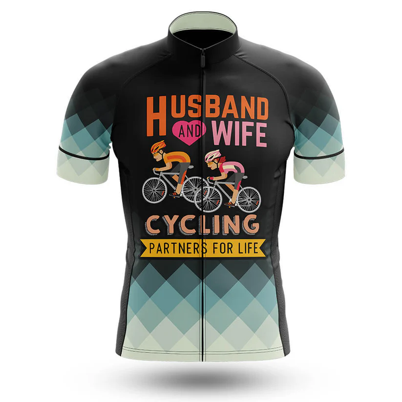 The Marines USMC Men Short Sleeve Cycling Set features a cycling jersey with cartoon illustrations of a man and woman riding bikes, text saying "Husband and Wife Cycling Partners for Life," and Chicago flag-inspired blue and white sleeves.