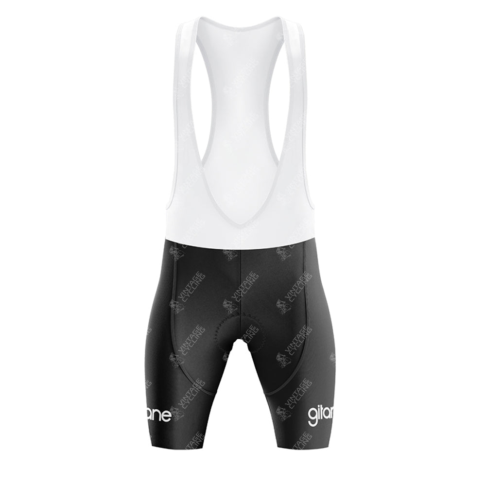 Inspired by the Renault Gitane Yellow Retro Short Sleeve Cycling Set, these cycling bib shorts feature a white upper, black shorts with "gilone" in white on the lower legs, displayed against a plain white background.