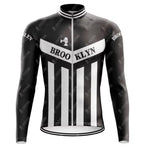 Retro cycling jersey featuring vertical black and white stripes with Brooklyn on the chest, an illustrated bell graphic on the upper left, inspired by Roger de Vlaemincks iconic Brooklyn Chewing Gum team style. Available as part of the Brooklyn Chewing Gum Retro Cycling Jersey Long Set (with Fleece Option).