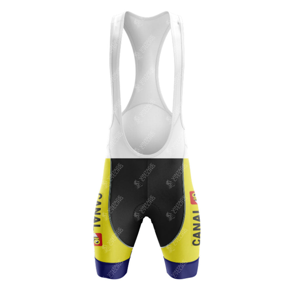 The KAS Retro Short Sleeve Cycling Set includes yellow and black bib shorts with a white upper, branded text on the sides, a logo near the hem, and blue accents at the leg bottom.