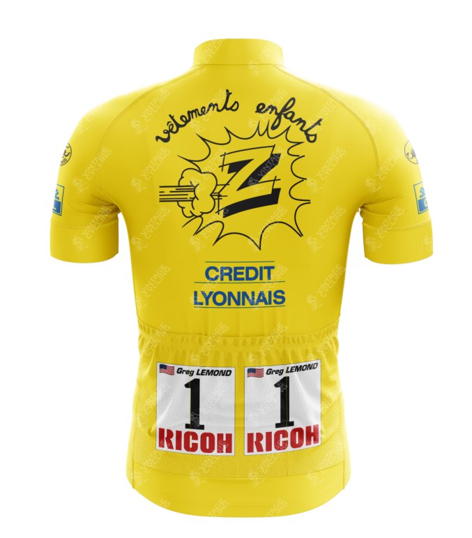 The Vetements Team Z Yellow Retro Cycling Jersey is a vibrant retro piece with a cartoon-style Z logo and vélomote enfants text. It features American flags, Greg Lemond, 