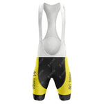 The vintage style of the 1983 del tongo Retro Short Sleeve Cycling Set is highlighted by yellow and black bib shorts with del tongo text on the legs, complemented by white shoulder straps against a plain backdrop.