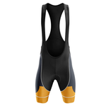 The U.S. Navy Veteran Short Sleeve Cycling Set features a black bib short with wide shoulder straps, dark gray side panels, and orange leg accents, ideal for customizable cycling gear, shown on a plain white background.