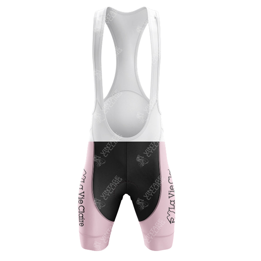 The Wonder Radar La Vie Claire Retro Short Sleeve Cycling Set features a white mesh upper and black shorts with light pink leg cuffs. It showcases a pink retro design with repeated LA VIE CLAIRE text and abstract bicycle graphics for a cohesive look.