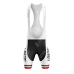 The front view of the Jacky Aernoudt Meubel Rossin Retro Short Sleeve Cycling Set features cycling bib shorts with a white upper and black shorts. Red stripe accents on the lower thighs complement the AERONODT text on the sides.