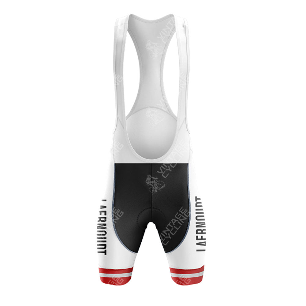 The front view of the Jacky Aernoudt Meubel Rossin Retro Short Sleeve Cycling Set features cycling bib shorts with a white upper and black shorts. Red stripe accents on the lower thighs complement the AERONODT text on the sides.