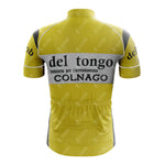 The 1983 del tongo Retro Short Sleeve Cycling Set radiates vintage cycling style with its yellow jersey, black and white accents, iconic del tongo and COLNAGO logos, a high collar, gray side panels, and rear pockets for essentials.