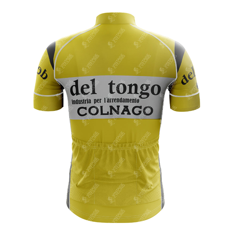 The 1983 del tongo Retro Short Sleeve Cycling Set radiates vintage cycling style with its yellow jersey, black and white accents, iconic del tongo and COLNAGO logos, a high collar, gray side panels, and rear pockets for essentials.