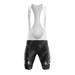 Front view of black cycling bib shorts, part of the Bobet Hutchinson BP Retro Short Sleeve Cycling Set, featuring a white upper section with shoulder straps and white logos. The design is sporty and fitted for aerodynamic performance.