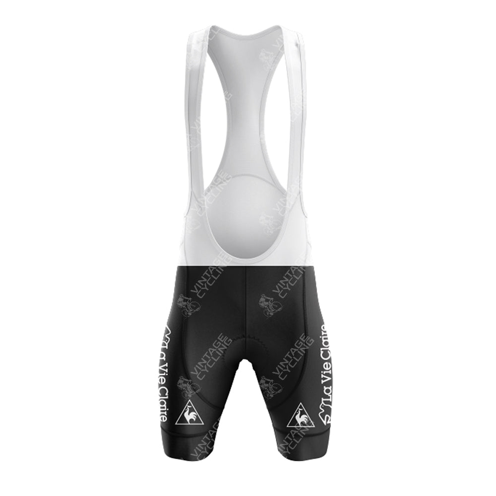 Front view of black cycling bib shorts, part of the Bobet Hutchinson BP Retro Short Sleeve Cycling Set, featuring a white upper section with shoulder straps and white logos. The design is sporty and fitted for aerodynamic performance.