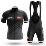 The Sloth Team Men Short Sleeve Cycling Set is a black cycling jersey and bib shorts set featuring AUSTRIA and the Austrian flag, with matching text and flag on both pieces. The set includes a front-zip jersey and bib shorts with shoulder straps.