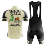 The Denmark Black Men Short Sleeve Cycling Set includes a performance jersey with "Sloth & Turtle Best Cycling Buddies For Life" and cute cartoon sloth and turtle on bikes, paired with matching black cycling bib shorts.