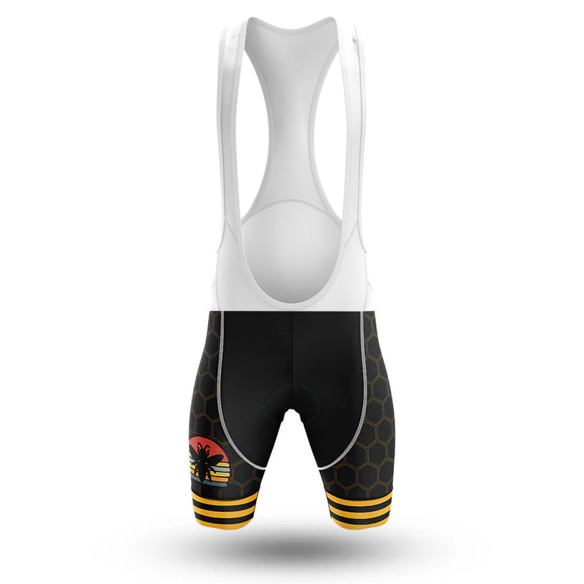 Front view of black U.S.Army V2 Men Short Sleeve Cycling Set bib shorts featuring a white upper, honeycomb leg pattern, yellow-striped leg openings, and a red-and-yellow stylized bee—ideal to pair with your favorite cycling jersey.