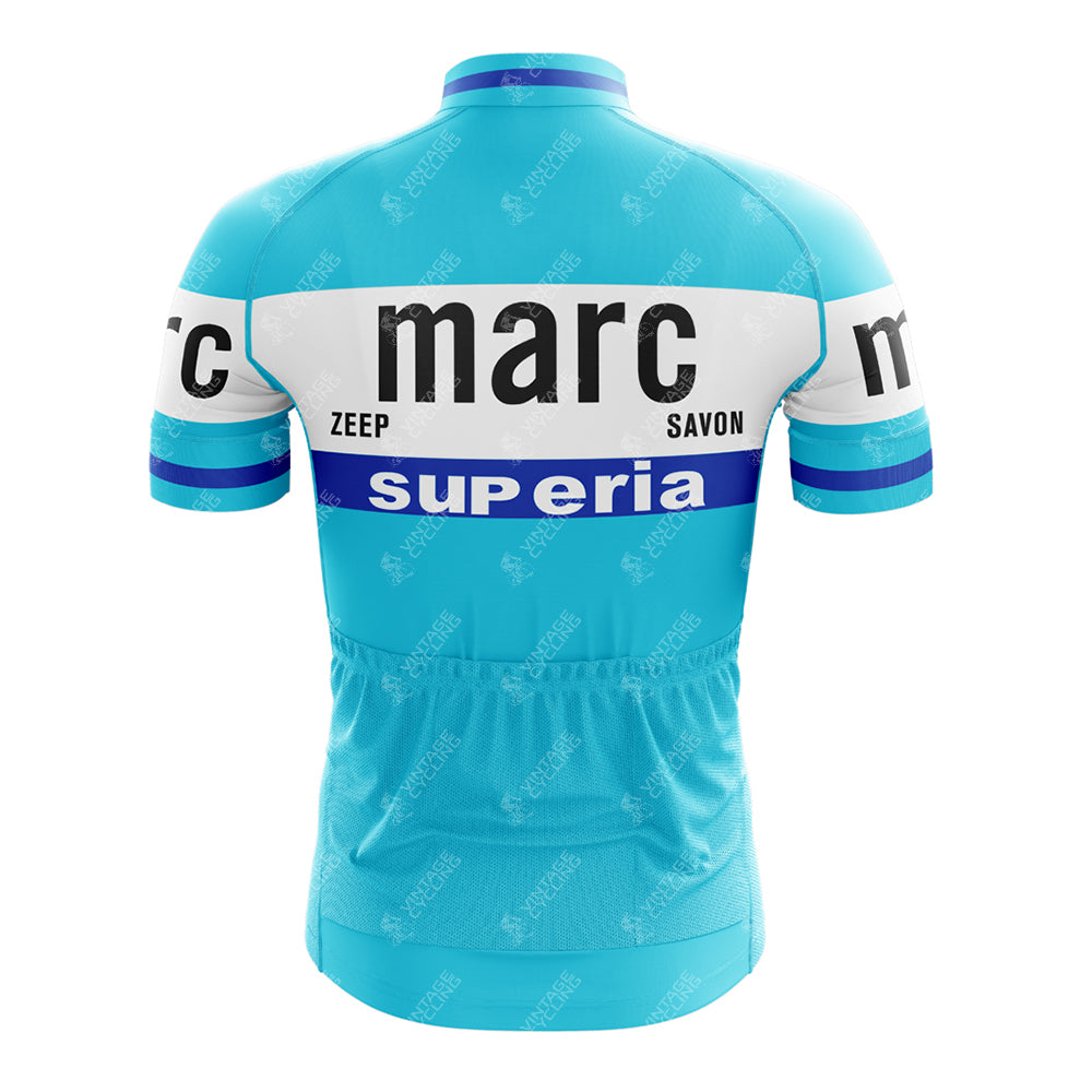 The Marc Superia Blue Retro Short Sleeve Cycling Set features light blue fabric with white and blue horizontal stripes, plus “marc,” “zeep,” “savon,” and “superia” printed on the back. A classic cycling set for any ride.