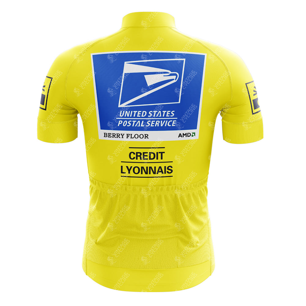 The EPEDEX Tricatel Retro Short Sleeve Cycling Set is a yellow jersey with a large blue and white United States Postal Service logo on the back, "Berry Floor," "AMD," and "Credit Lyonnais" details, plus smaller sleeve sponsor logos.