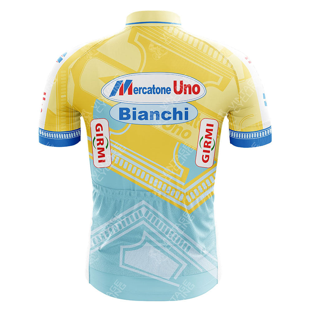 Back view of a Credit Agricole Retro Short Sleeve Cycling Jersey showcasing a vibrant design with bold logos, abstract patterns, and geometric shapes.